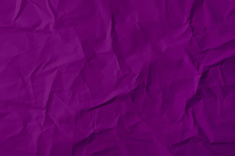 A dark purple paper texture, crumpled surface finish